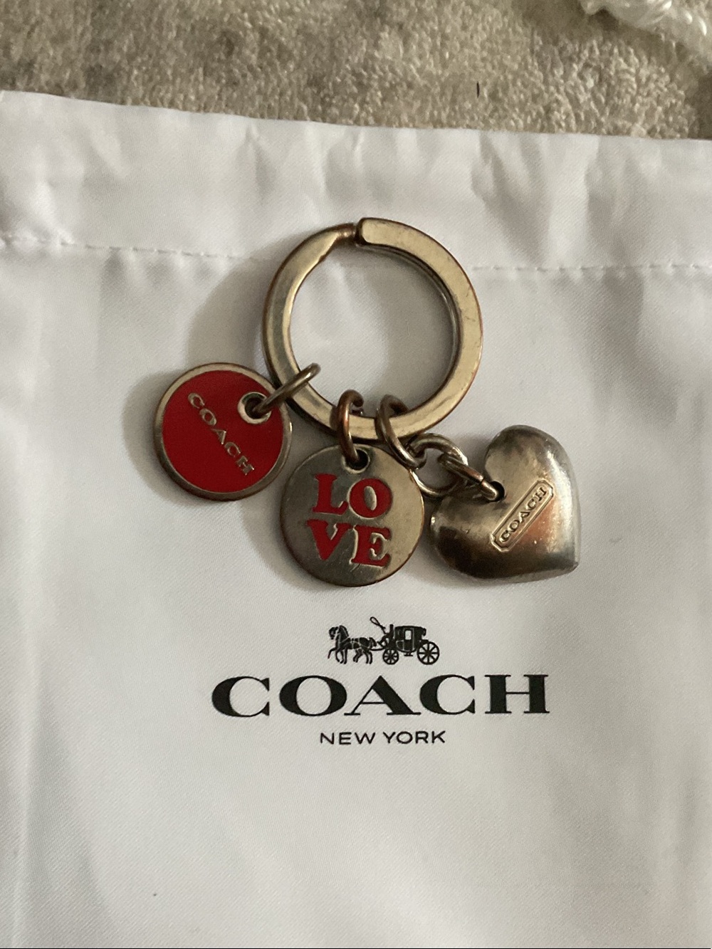 Coach Silver Tone Keychain with Red Enamel Accents